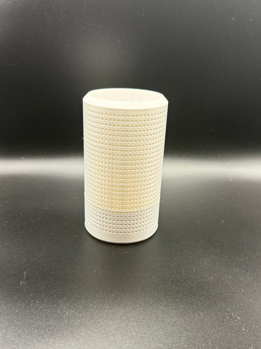 White textured cylindrical object on a black background